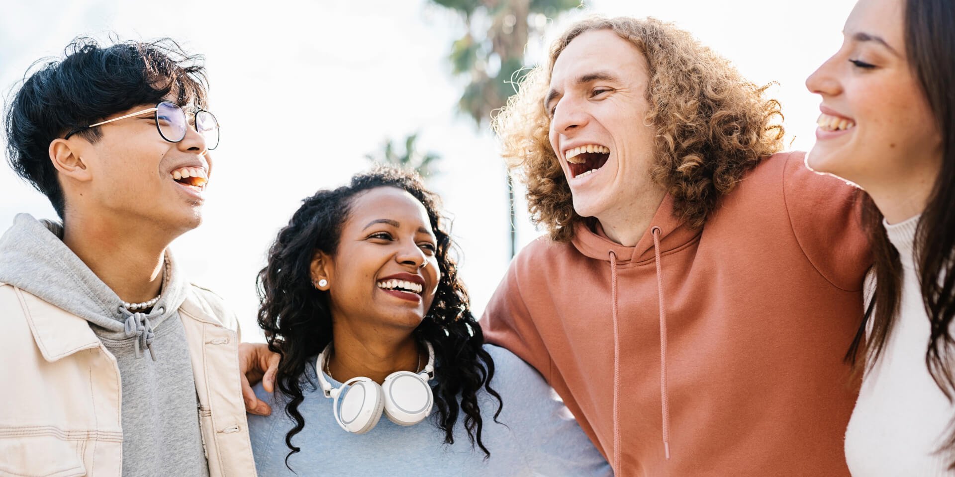 A group of friends laughing together to a healthy life