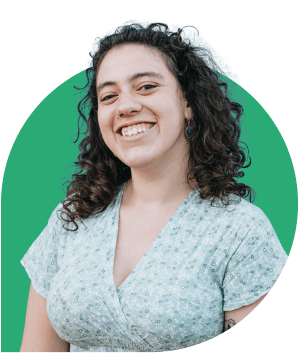 A smiling woman with curly hair