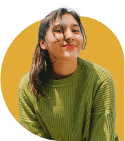 A girl in a green sweater sitting after TheraLeaf treatment